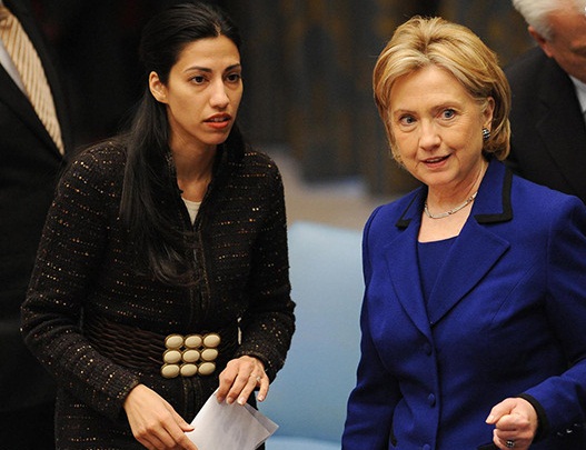 US Secretary of State Hillary Clinton (R) and aide Huma Abedin speak before Clinton chaired the Security Council Session on Women, Peace and Security during which the council voted on a resolution to address sexual violence in armed conflict September 30, 2009 at UN headquarters in New York.  AFP PHOTO/Stan HONDA (Photo credit should read STAN HONDA/AFP/Getty Images)