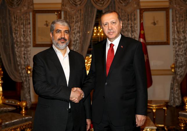 Turkish President Tayyip Erdogan (R) meets with Hamas leader Khaled Meshaal in Istanbul, Turkey, December 19, 2015 in this handout photo provided by the Presidential Palace. REUTERS/Kayhan Ozer/Presidential Palace/Handout via Reuters